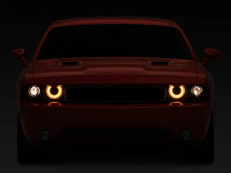 Red Dodge Challenger with illuminated headlights and sequential turn signals for a bold look