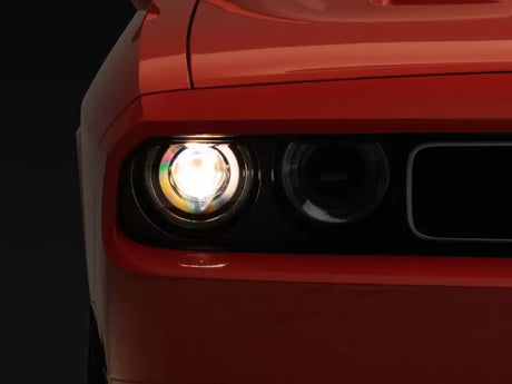 Orange car headlight illuminated on dodge challenger with sequential turn signals