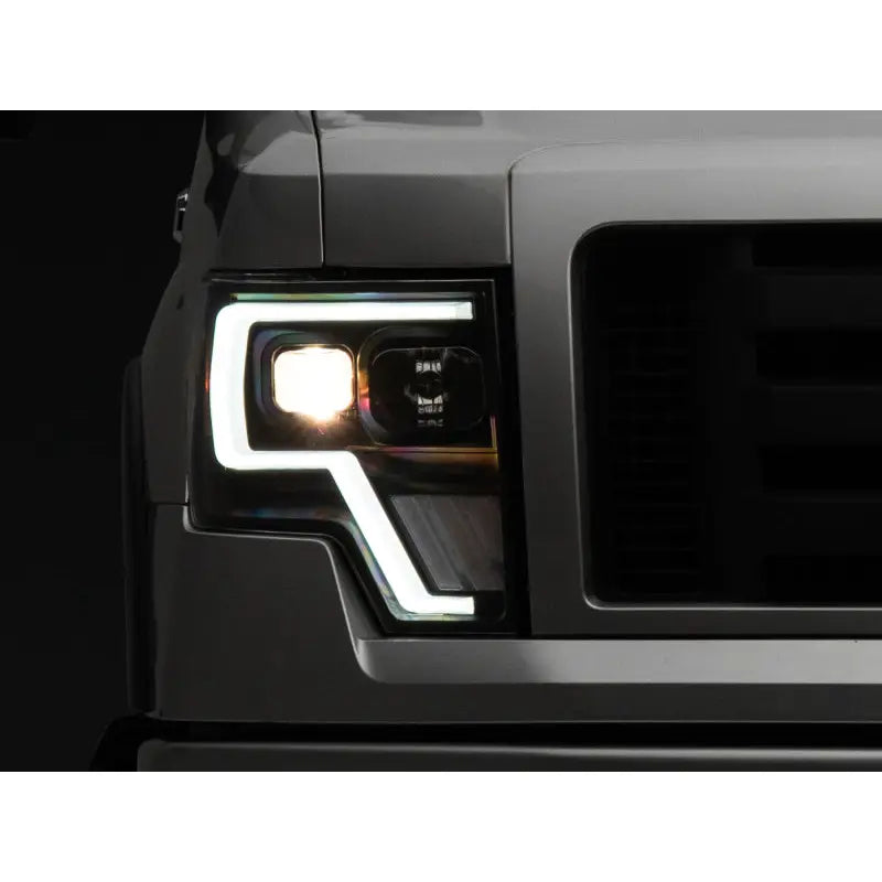 Raxiom T544003 Raxiom 09-14 Ford F-150 G4 Projector Headlights- Black Housing (Clear Lens)