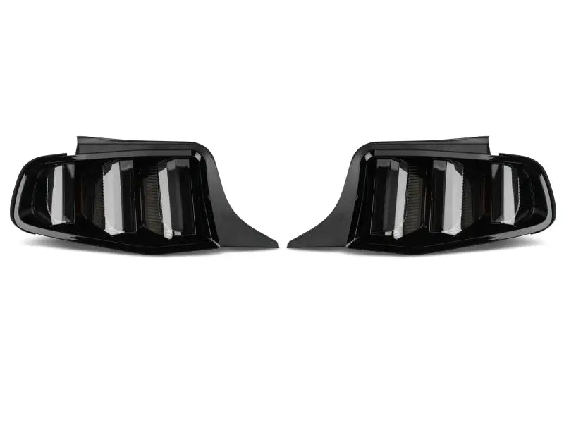 Pair of dark automotive tail lights showing Raxiom Vector V2 LED Tail Lights for Ford Mustang