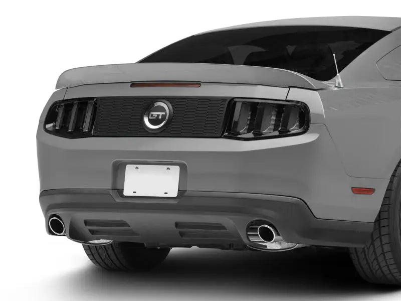 Gray Mustang GT rear view with Raxiom Vector V2 LED Tail Lights in gloss black housing