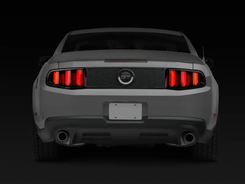 Gray Ford Mustang rear view with Raxiom Vector V2 LED tail lights in gloss black housing