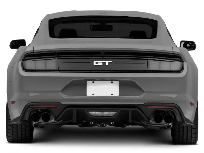 Rear view of gray sports car with Raxiom profile LED tail lights on Ford Mustang