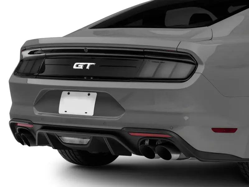 Rear view of gray Ford Mustang GT with smoked profile LED tail lights in gloss black housing