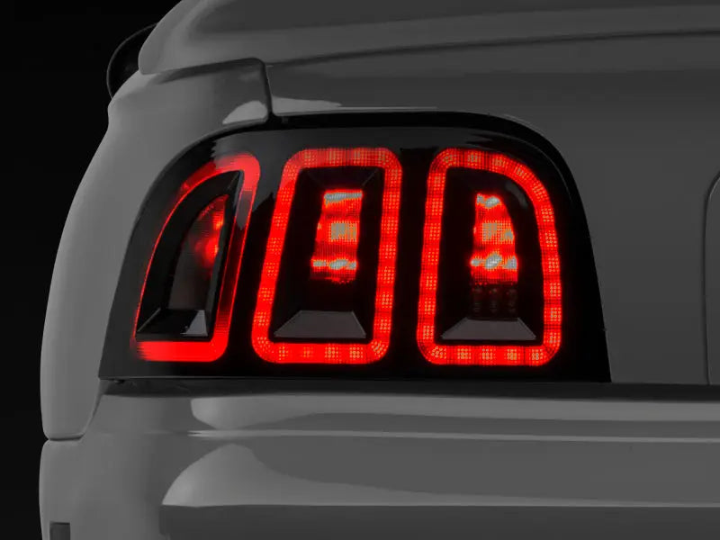 Raxiom 96-98 Ford Mustang Icon LED Tail Lights- Black Housing (Smoked Lens) - Truck & Automotive