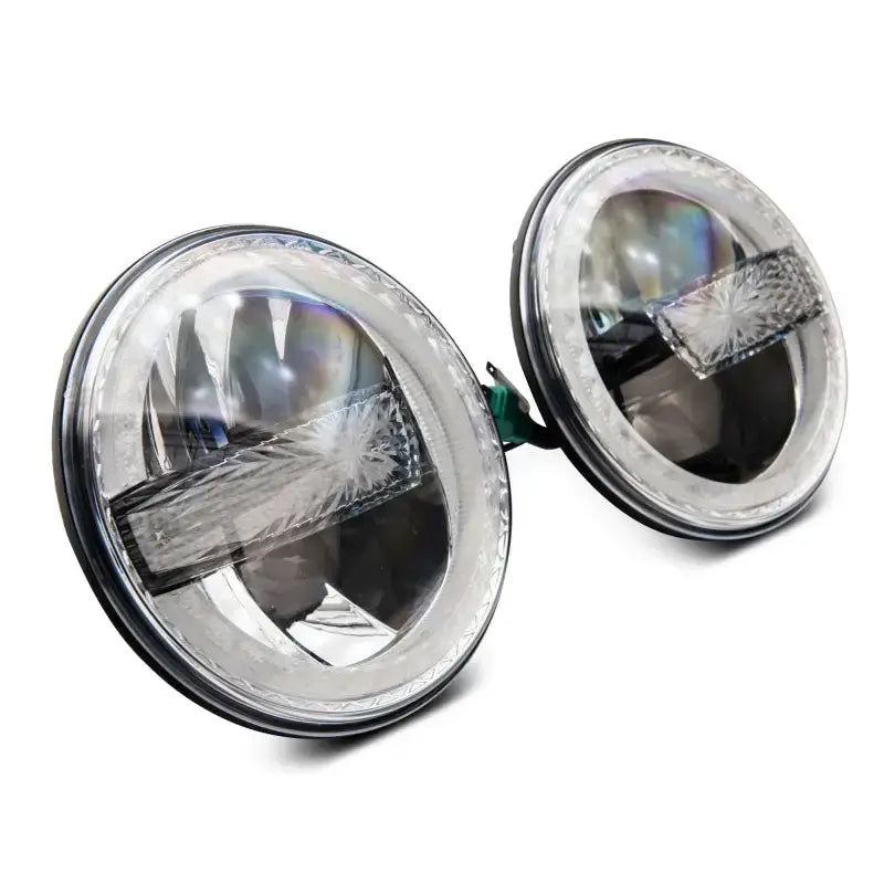 Raxiom 97-18 Jeep Wrangler TJ/JK 7-Inch LED Headlights w/ Halos- Black Housing (Clear Lens) - J155018