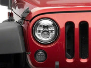 Red Jeep headlight featuring Raxiom led daymaker headlights for Jeep Wrangler TJ/JK