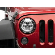 Red Jeep headlight featuring Raxiom led daymaker headlights for Jeep Wrangler TJ/JK