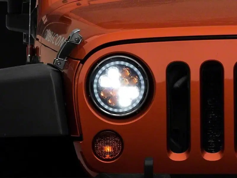 Orange Jeep Rubicon front with Raxiom Axial Spider LED headlights for Jeep Wrangler