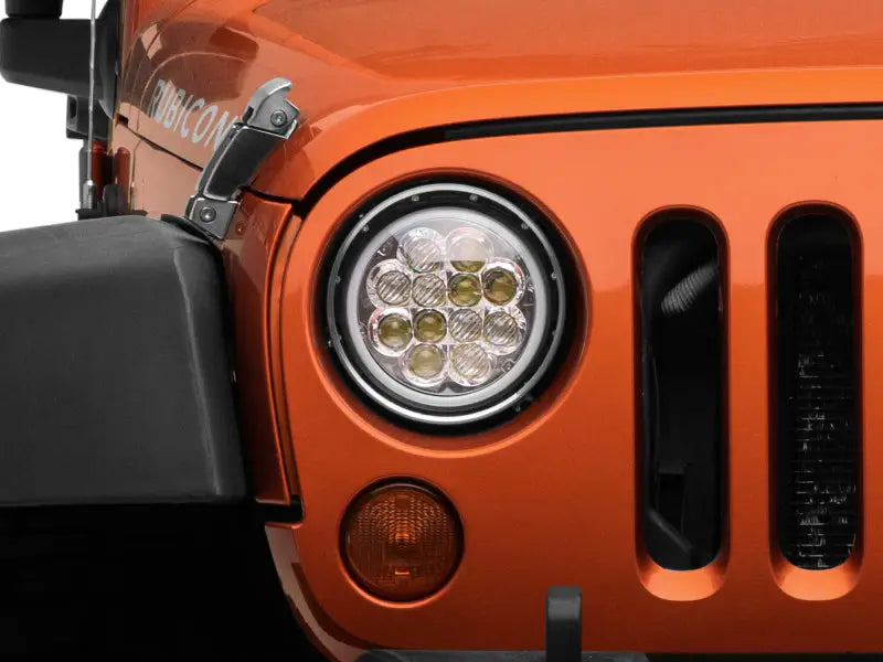 Orange Jeep Wrangler with Axial Spider LED Headlight front view in chrome housing