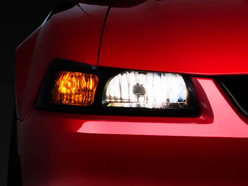 Red car headlight from Raxiom Axial Series OE Style Headlights with smoked lens