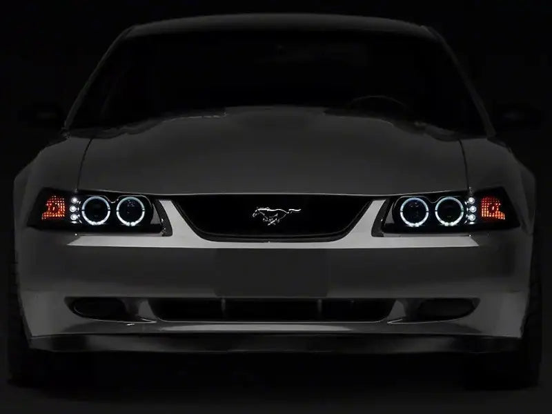 Raxiom 99-04 Ford Mustang Dual LED Halo Projector Headlights- Black Housing (Smoked Lens) - Truck & Automotive