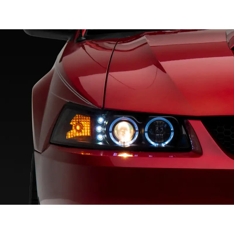 Raxiom 101684 Raxiom 99-04 Ford Mustang Dual LED Halo Projector Headlights- Black Housing (Clear Lens)