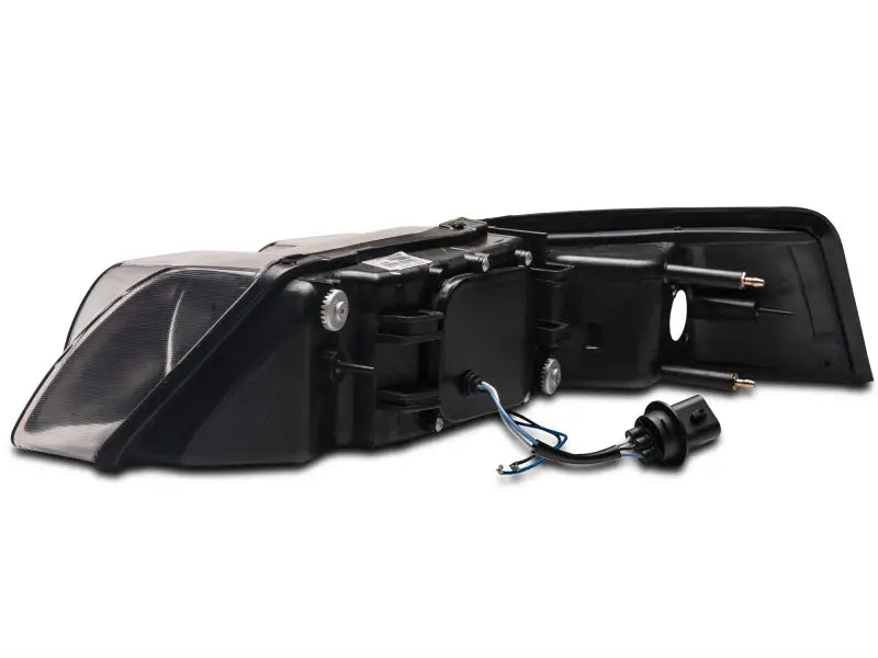 Black car tail light assembly showing LED halo projector for Ford Mustang headlights