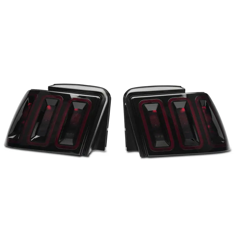 Raxiom 100807 Raxiom 99-04 Ford Mustang Excluding 99-01 Cobra Icon LED Tail Lights- Black Housing (Smoked Lens)