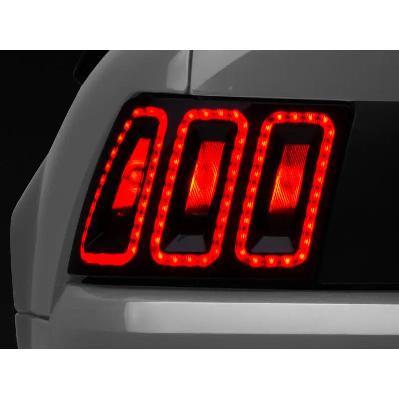 Raxiom 100807 Raxiom 99-04 Ford Mustang Excluding 99-01 Cobra Icon LED Tail Lights- Black Housing (Smoked Lens)