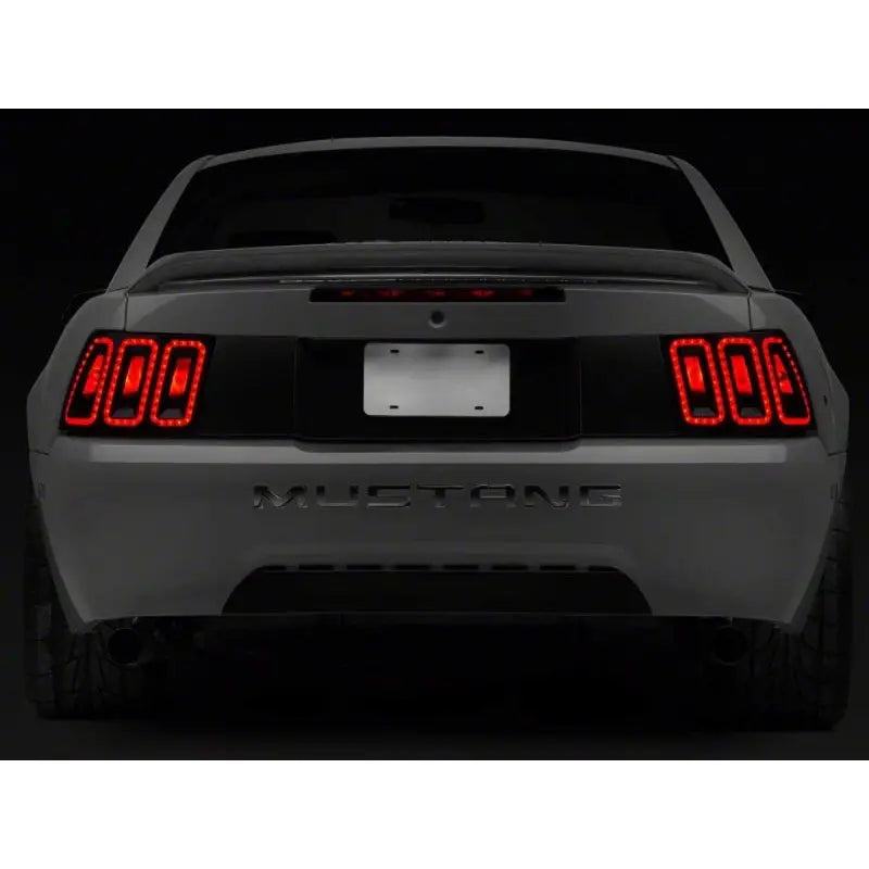 Raxiom 100807 Raxiom 99-04 Ford Mustang Excluding 99-01 Cobra Icon LED Tail Lights- Black Housing (Smoked Lens)