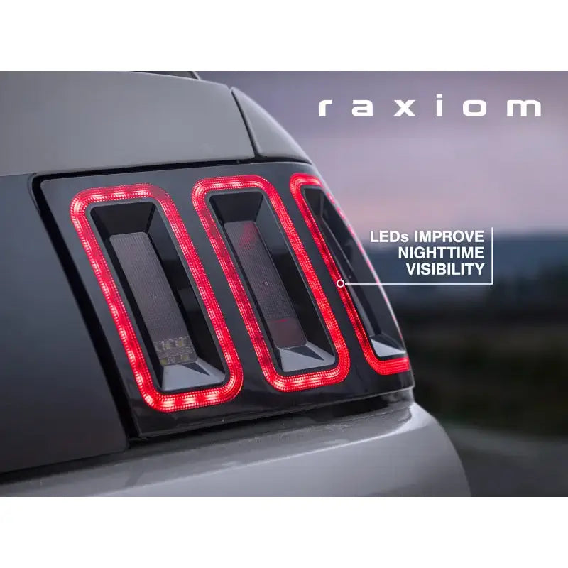 Raxiom 99-04 Ford Mustang Excluding 99-01 Cobra Icon LED Tail Lights- Black Housing (Smoked Lens) - Truck & Automotive