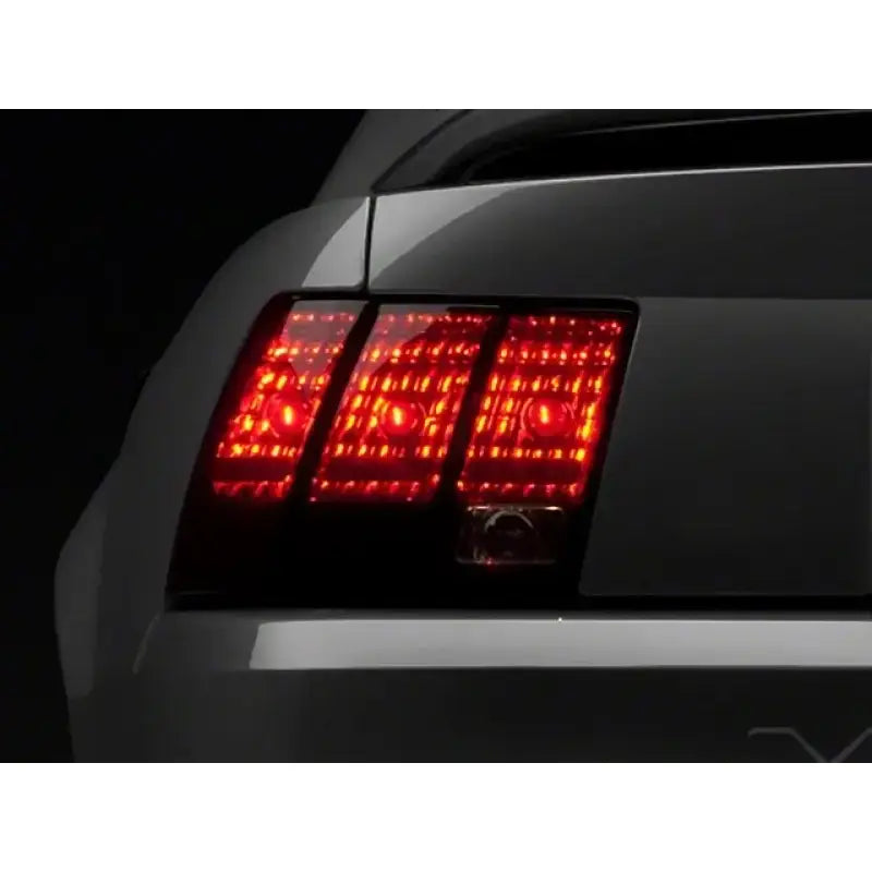 Raxiom 99-04 Ford Mustang Excluding 99-01 Cobra Tail Lights- Black Housing (Smoked Lens) - Truck & Automotive