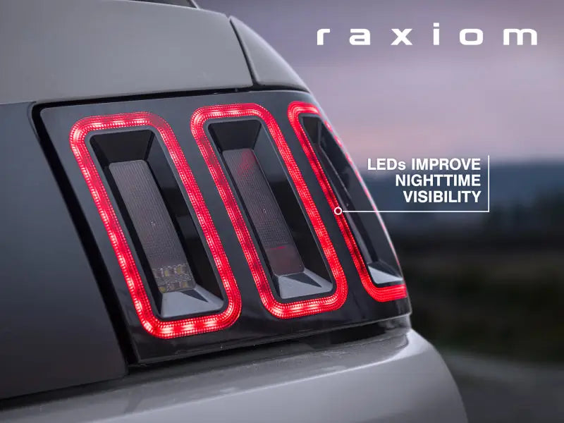 Raxiom 99-04 Ford Mustang Excluding 99-01 Cobra Icon LED Tail Lights- Black Housing (Smoked Lens) - Truck & Automotive