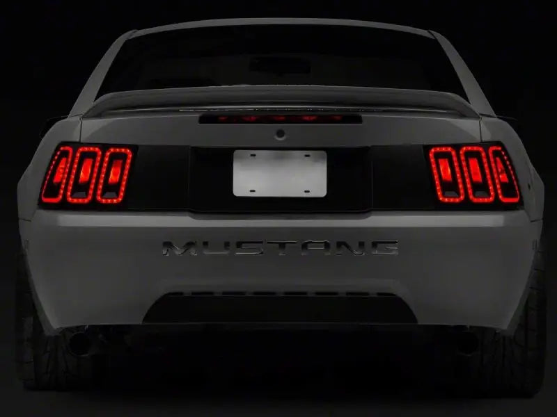 Raxiom 99-04 Ford Mustang Excluding 99-01 Cobra Icon LED Tail Lights- Black Housing (Smoked Lens) - Truck & Automotive