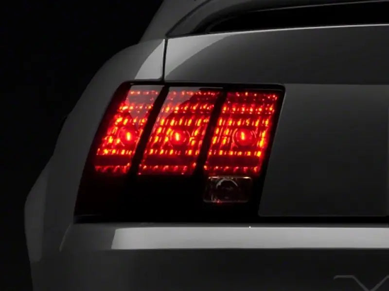 Raxiom 99-04 Ford Mustang Excluding 99-01 Cobra Tail Lights- Black Housing (Smoked Lens) - Truck & Automotive