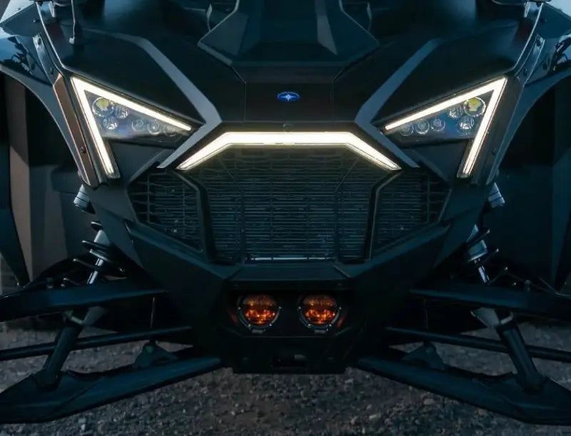 Front view of dark off-road vehicle with Razor 360 Series Amber Pro Grille Light Kit