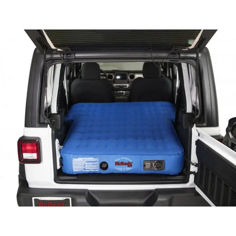 Blue air mattress in vehicle.