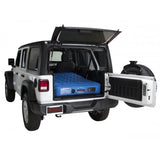 White Jeep Wrangler with an air mattress.