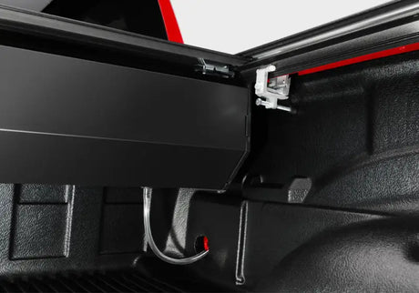 Black truck bed cover for Tacoma 5ft Double Cab RetraxPRO XR in action