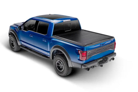 Blue Ford Raptor pickup with tonneau cover for Toyota Tundra CrewMax bed storage