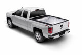White pickup truck with bed liner on Toyota Tundra CrewMax Retrax IX topper
