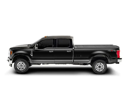 Black Ford F-150 Super Crew with RetraxPRO MX tonneau cover for super cab pickup