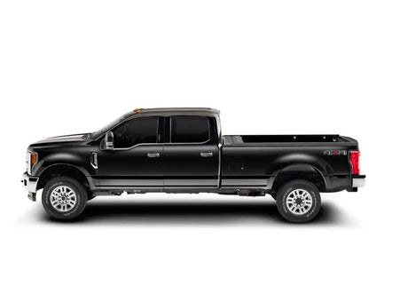 Black Ford F-Series Super Duty pickup truck with RetraxPRO MX for super crew and super cab