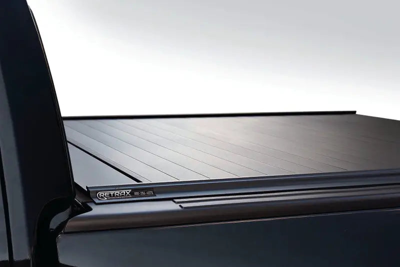 Black retractable truck bed cover for F-150 Super Crew and Super Cab models