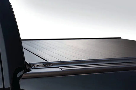 Black retractable truck bed cover for F-150 Super Crew and Super Cab models