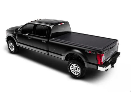 Black Ford F-Series Super Duty super crew pickup with tonneau cover for F-150 Super Crew