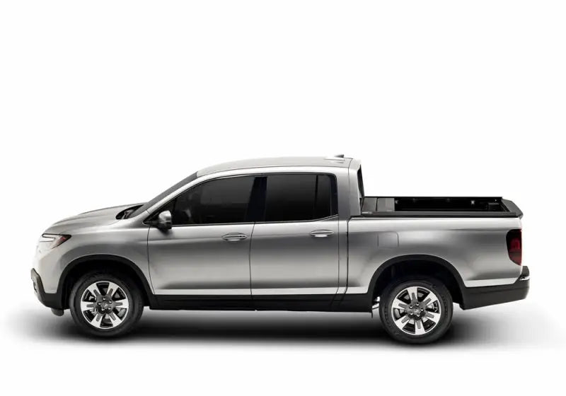 Silver four-door pickup truck with Ridgeline RetraxPRO MX and sealed ball-bearing rollers