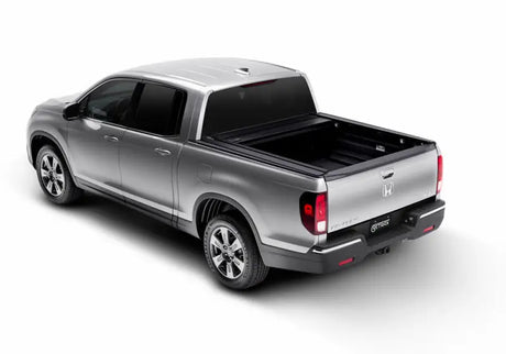 Silver Honda Ridgeline truck bed with RetraxPRO MX sealed ball-bearing rollers