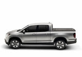 Silver pickup truck with Ridgeline RetraxPRO MX truck bed cover and sealed ball-bearing rollers