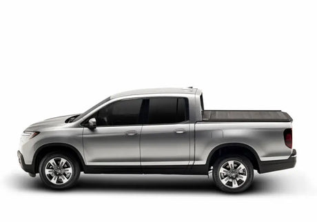 Silver pickup truck with Ridgeline RetraxPRO MX truck bed cover and sealed ball-bearing rollers