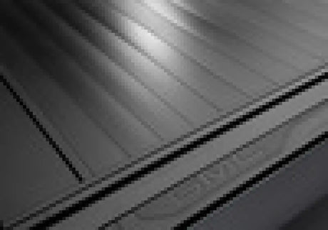 Gray metal roll-up door for Silverado Sierra truck bed RetraxPRO MX bed cover