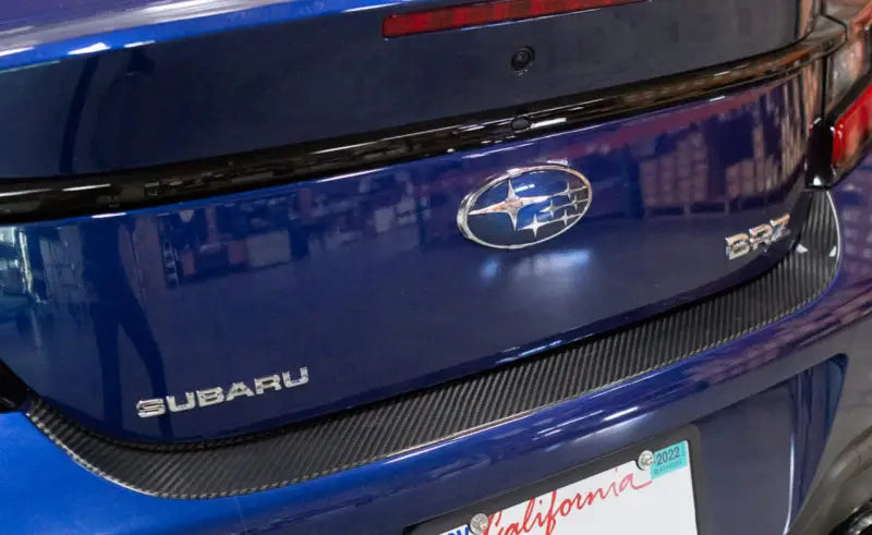 Blue Subaru BRZ trunk with dry carbon carbon step guard for sleek style
