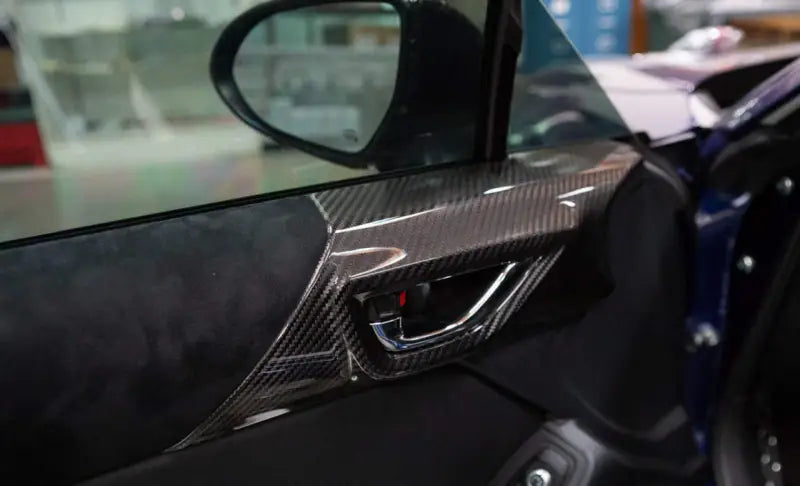Revel GT Dry Carbon trim covers for car door interior with sleek dry carbon finish