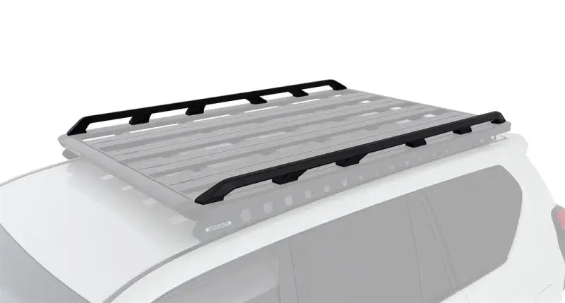 Black and silver Rhino Rack Pioneer roof rack platform on a white vehicle for easy hauling