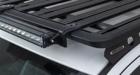 Black roof rack with LED light bar and Rhino-Rack Pioneer light bar adaptor pack