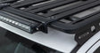 Black roof rack with light bar and Rhino-Rack Pioneer light bar adaptor in package