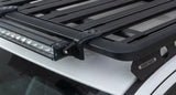 Black roof rack with light bar and Rhino-Rack Pioneer light bar adaptor in package