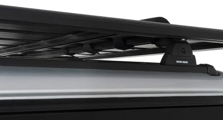 Rhino-Rack Pioneer wrap pads with straps for secure cargo on black roof rack