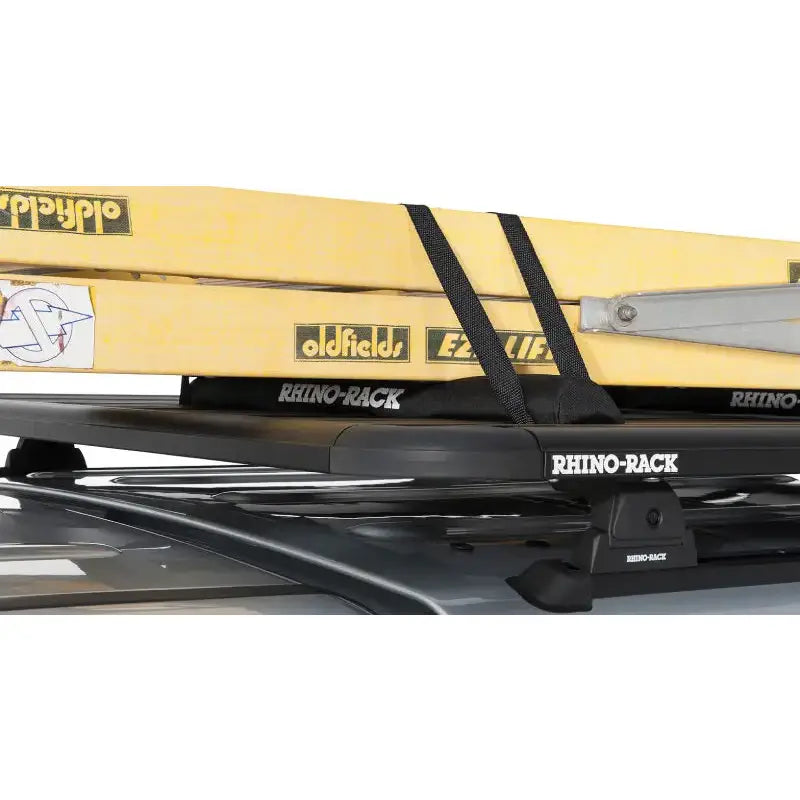 Yellow kayak on Rhino-Rack Pioneer wrap pads with straps